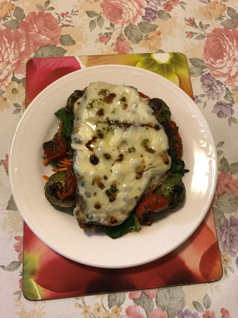 Edam cheese Porterhouse with baked Brussel sprouts and semi dried tomatoes on a bed of salads.JPG